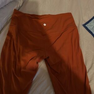 Lululemon burnt orange crop pants. Good condition. No rips, tears or stains.